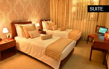 Habitación con dos camas sencillas